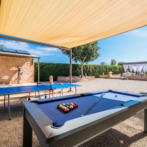 Unleash your competitive side with a game of pool or ping pong