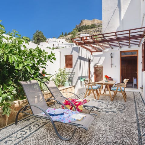 Soak up the Greek sunshine on the loungers 