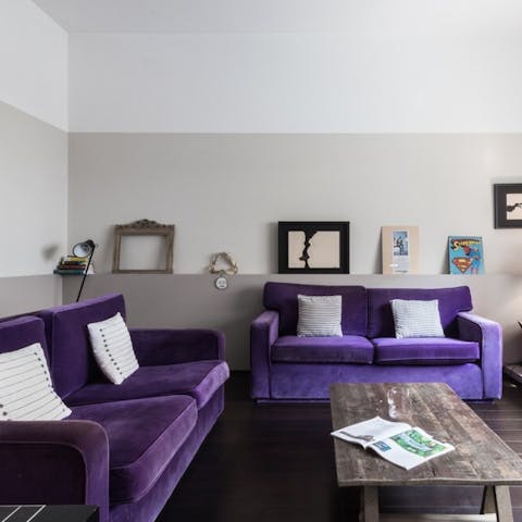 Sit back and relax on the velvet sofas after a busy day