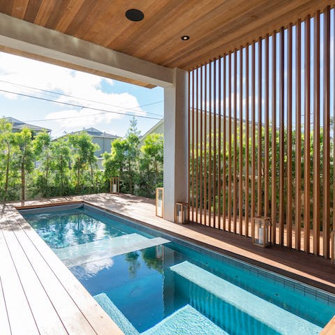 Marvel at the design of the indoor/outdoor pool and hot tub