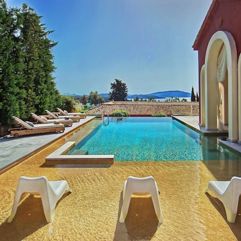 Cool off from the hot Grecian sunshine with a dip in the private pool, or relax on an in-pool lounger