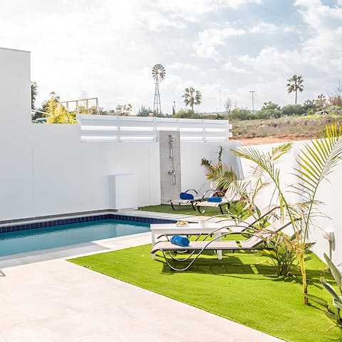 Lounge in the sun beside the private pool