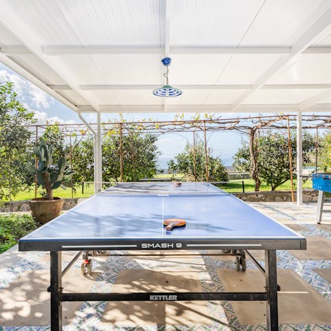 Play a game of outdoor ping-pong or table football