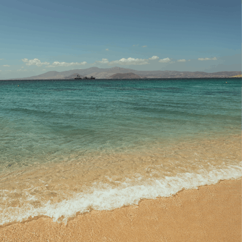 Walk or drive down to the soft sands of Agios Prokopios Beach