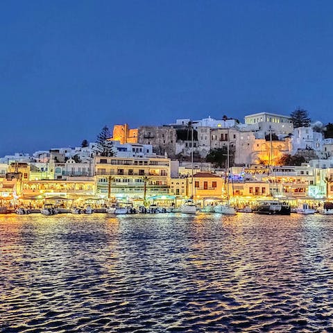 Head to the waterside tavernas of Naxos Town, a ten-minute drive away