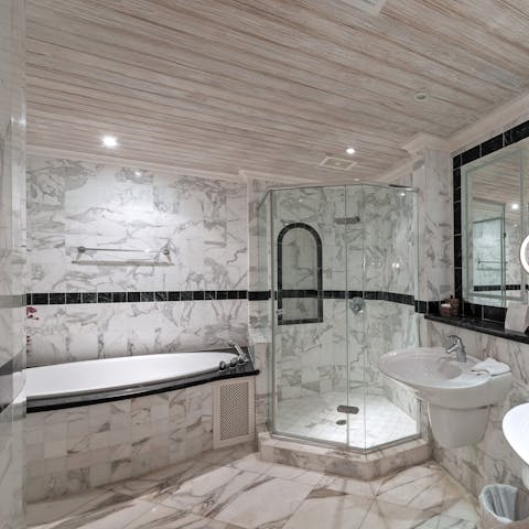 Treat yourself to a luxurious bath in this striking marble tub