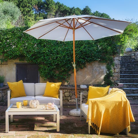 Chill out in the shade in your vibrant outdoor lounge area