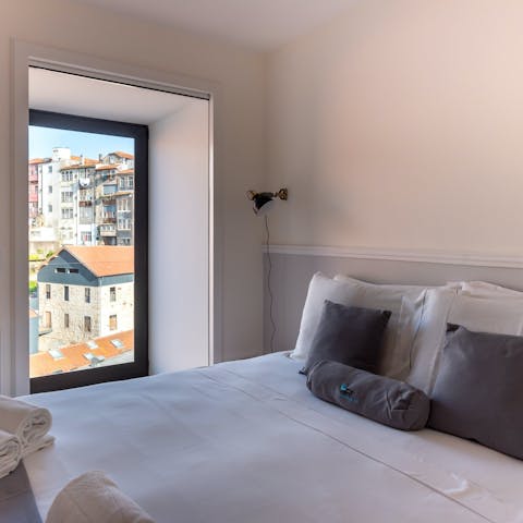 Wake up to views of Porto's rooftops each morning