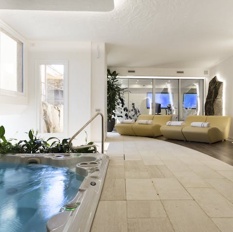 Relax in the hydro-massage tub after a workout in the home gym