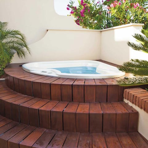 Relax in the luxurious hot tub 