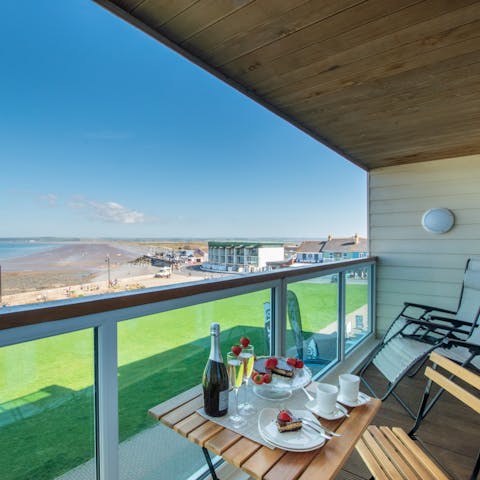 Tuck into an afternoon tea with beach views from the balcony 