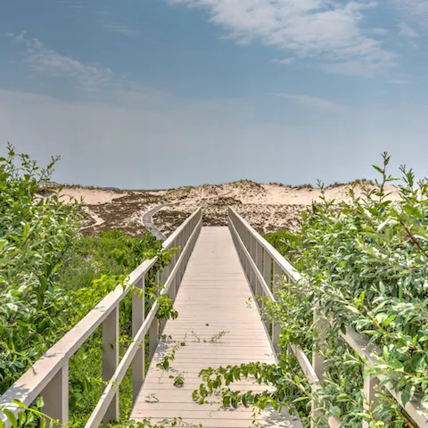 Follow the home's boardwalk down to the beach