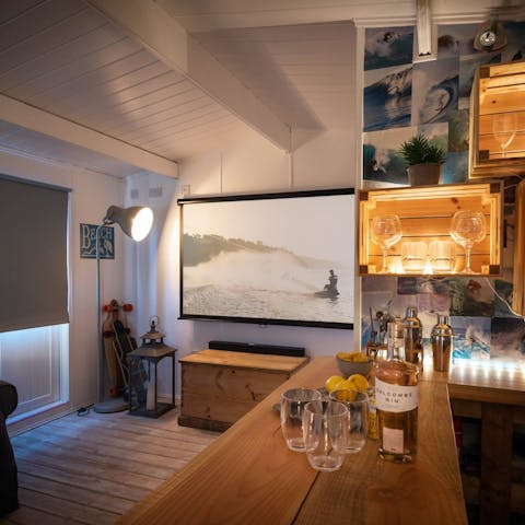 Watch a film in the exterior cinema room, complete with a bar and WC
