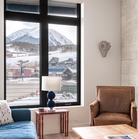 Look out across snowy peaks from the warmth of your homely living space