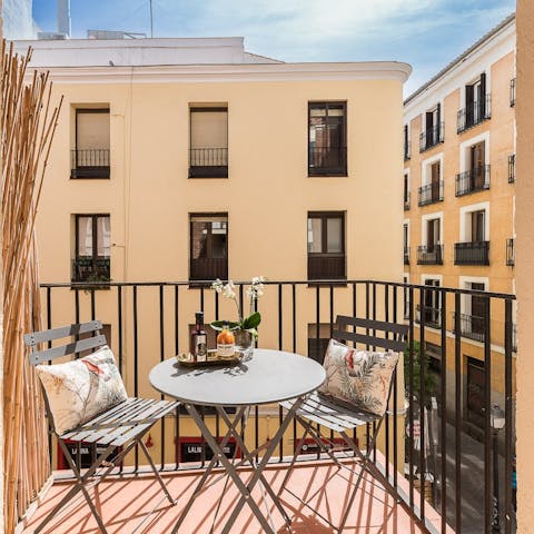 Sip Sangria on the balcony after a day of sightseeing