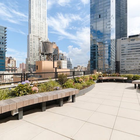 Enjoy skyline views over NYC from the rooftop terrace
