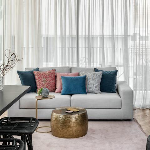 Kick back and relax on the comfy sofa in the stylish living room 