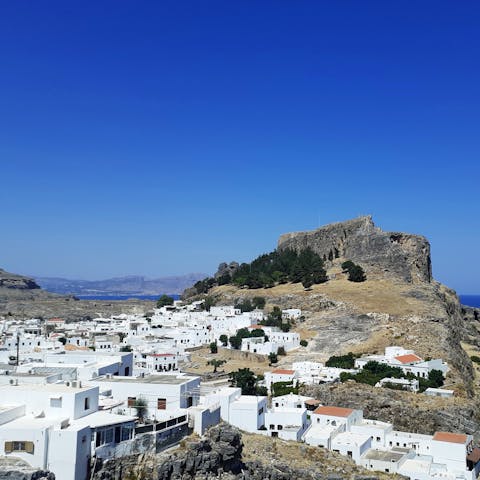 Visit beautiful Lindos, with its charming streets and its stunning Acropolis, a twenty-minute drive away