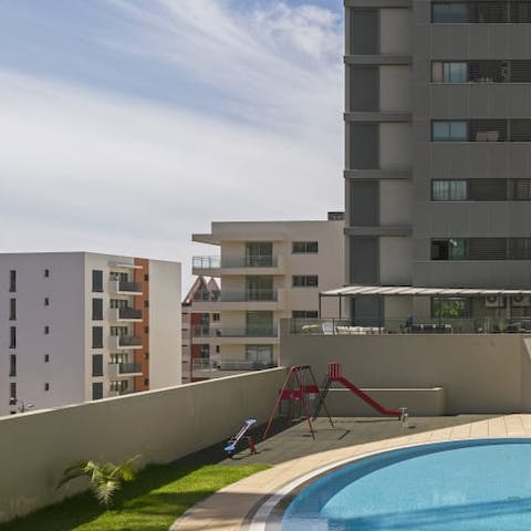 Let the kids enjoy the communal playground and paddling in the pool