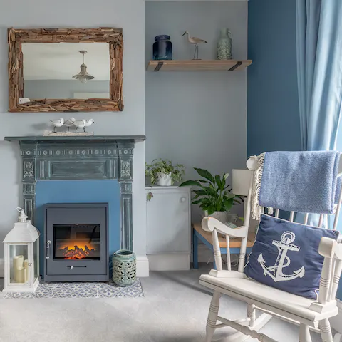 Get comfortable in the rocking chair beside the fireplace on chilly evenings 