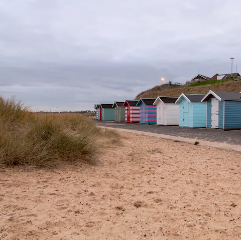 Stroll along Pakefield's shoreline and admire the colourful beach huts