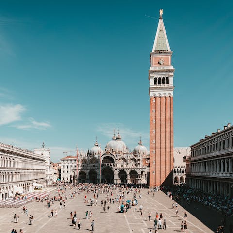 Soak up the lively atmosphere of St. Mark's Square, a fifteen-minute walk away