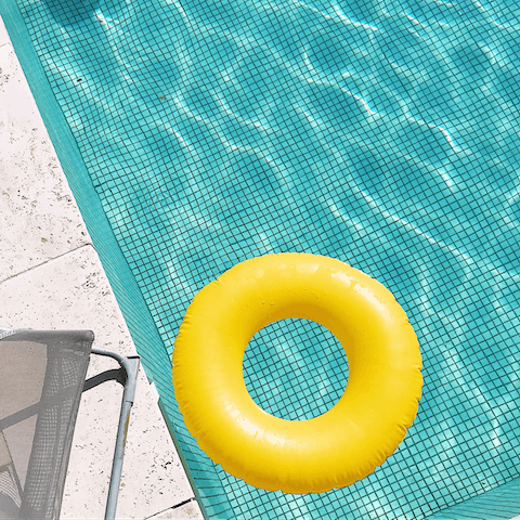 Take a relaxing swim in the pool amid beautiful greenery
