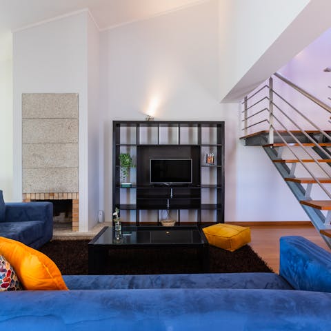 Sink into the plush sofa and unwind with a glass of wine
