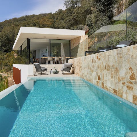 Sink into the sparkling infinity pool for some respite from the Spanish heat