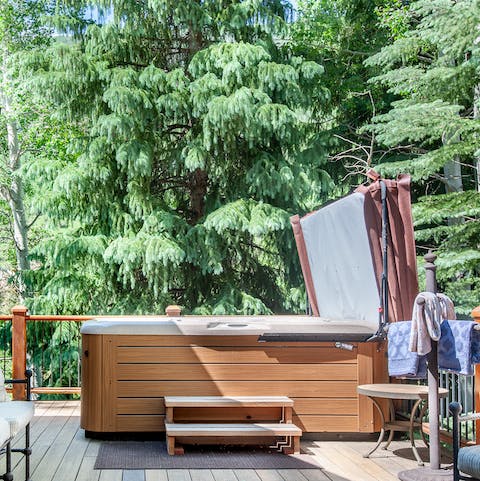 Relax in the hot tub surrounded by trees