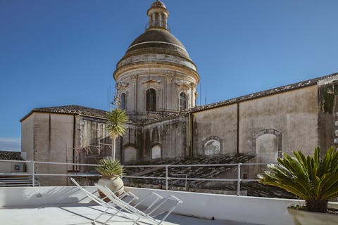Enjoy fantastic views as you sunbathe in the deck chairs on the upper balcony