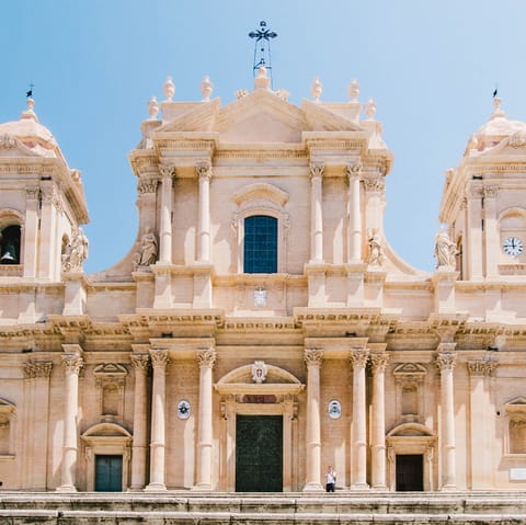 Visit Noto's historic cathedral – a short nine-minute walk away