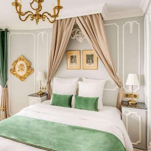 Sleep like royalty in the elegant mint green master bedroom 