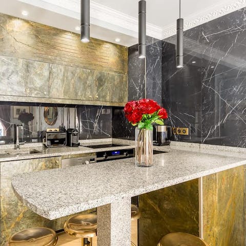 Enjoy your morning pain au chocolats at the gold-finished marble breakfast bar