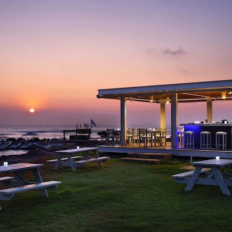 Sip a cocktail at the nearby beach bar