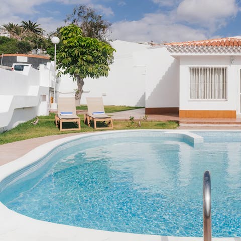 Plunge into your private outdoor pool and feel refreshed after a morning of sunbathing