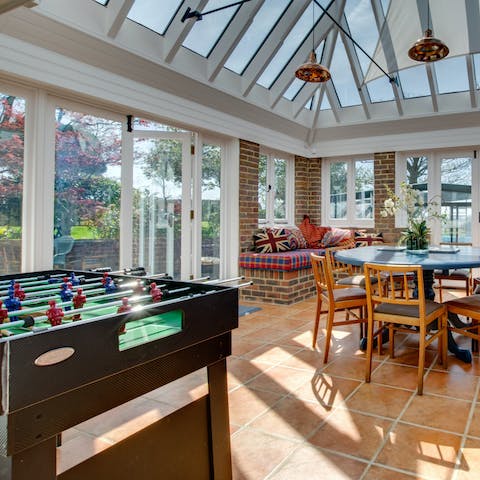 Play a few games of table football in the conservatory