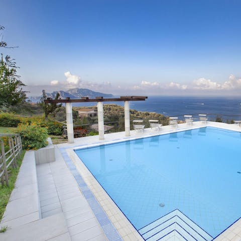 Float in the pool and admire the Capri and Vesuvius views