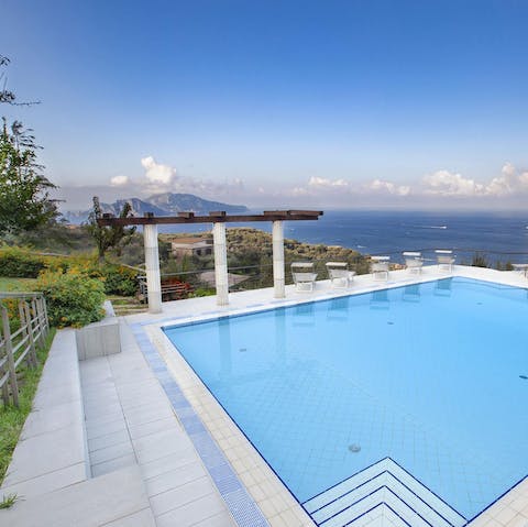 Float in the pool and admire the Capri and Vesuvius views