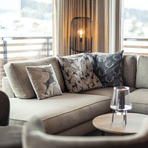 Relax in the plush living area while soaking up views of the Kitzbühel Alpes