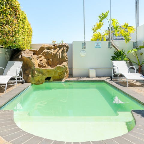 Laze on loungers in the sun or cool off with a refreshing dip in the communal outdoor pool