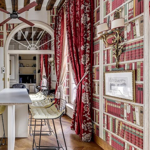 Enjoy a kitchen surrounded by bookshelf wallpaper