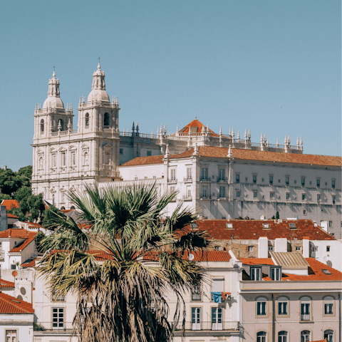 Explore the nearby historic streets of Alfama