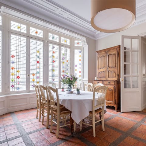 Enjoy some croissants as light streams through the stained-glass window