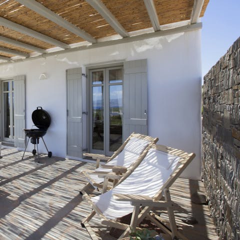 Stretch out on the loungers for a siesta under the pergola