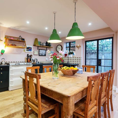 Gather together for meals in the colourful kitchen or go out to the garden for drinks