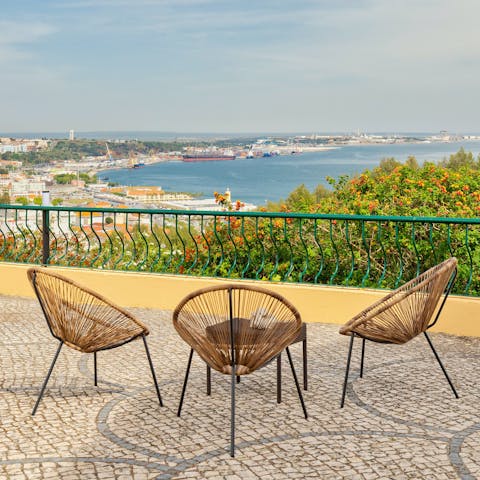 Take in stunning views over Setúbal Bay, a sundowner in hand
