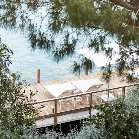 Feel the sweet sea breeze from your own private beach platform