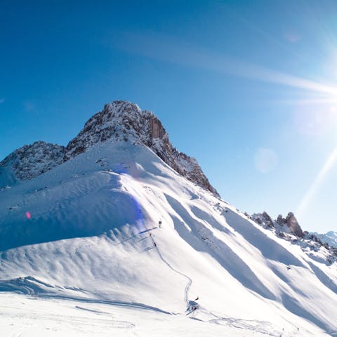 Catch a ski lift right by your chalet up to the Huez's alpine slopes