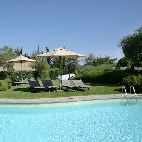 Swim in the communal pool to cool off in the Tuscan heat